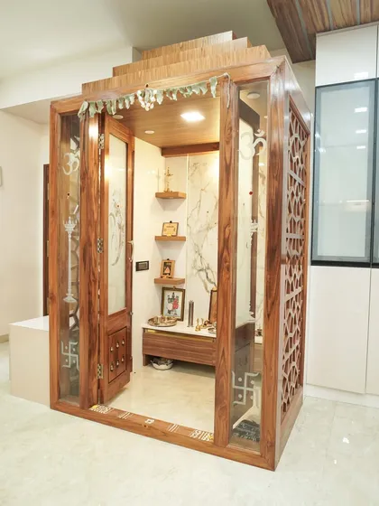 We designed this standalone traditional pooja mandir as a serene sanctuary within the home. The intricate wooden craftsmanship, detailed jali work, and dedicated lighting create a peaceful and divine space for prayer and reflection.