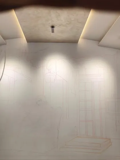 The initial phase of a large wall mural in Bandra, showing the foundational outlines sketched onto the wall. This stage is crucial for establishing the composition and perspective before any color is applied.