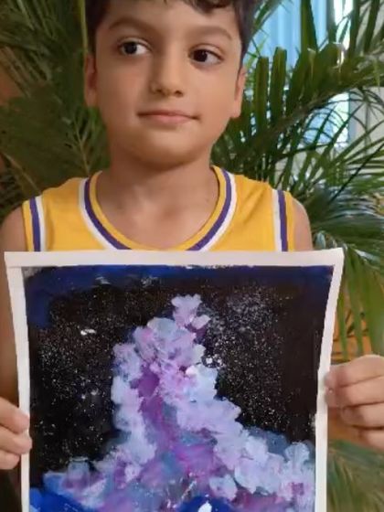 A close-up of the textured, colorful sky in this student's aurora painting.