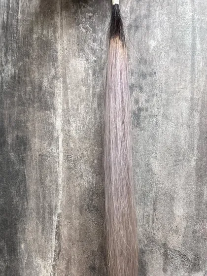 Here, the cool-toned lavender looks different against a warmer, textured background. This is why we talk to you about the colors you usually wear.