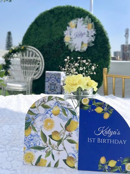 Celebrating Katya's first birthday with a sunny Amalfi theme. The custom stationery and lemon-print details set a cheerful and sophisticated tone for this outdoor brunch celebration.