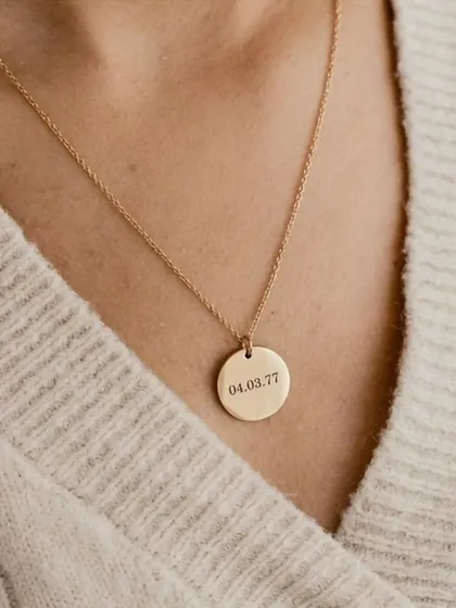 Keep a significant date close with this engraved round pendant. This piece is customized with a special date, making it a perfect anniversary gift or a memento of a life-changing day.