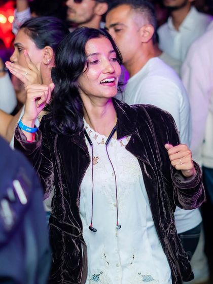 A guest dancing and enjoying the vibe at the White Party. The goal is always to create a space where people can relax and have a great time.