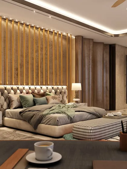 This opulent bedroom blends a modern aesthetic with extravagant materials and rich colors. A tufted headboard, vertical wood paneling, and a unique patterned rug create a haven of style and comfort for sophisticated living.