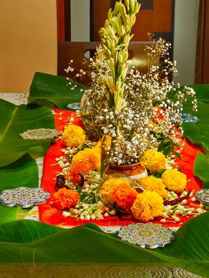 Another view of my supper club table decor. The combination of banana leaves, fresh flowers, and simple coasters creates a rustic yet elegant setting for a memorable meal.