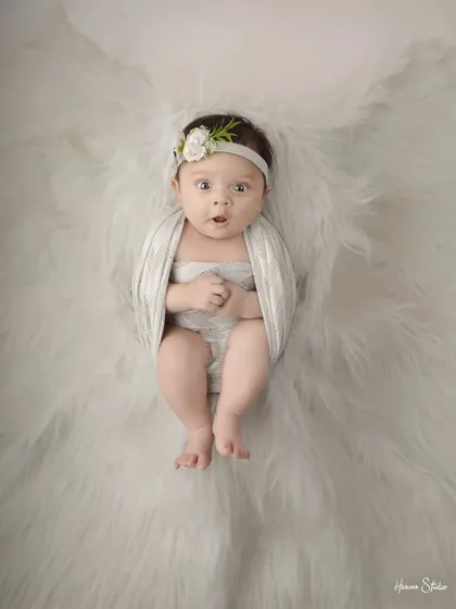 Sometimes, the most magical moments happen when they are wide awake. I love capturing those curious, expressive faces, showing the budding personality of your little one.