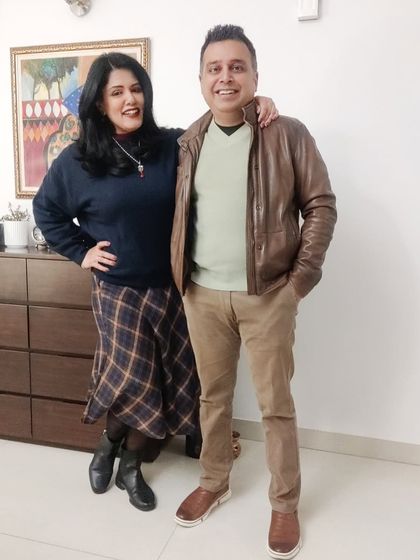 For a holly jolly Christmas dinner, I wore this tartan skirt with a warm navy jumper and boots. The ruby, kundan, and pearl jewelry adds a festive, traditional touch to the western outfit.