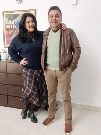 For a holly jolly Christmas dinner, I wore this tartan skirt with a warm navy jumper and boots. The ruby, kundan, and pearl jewelry adds a festive, traditional touch to the western outfit.