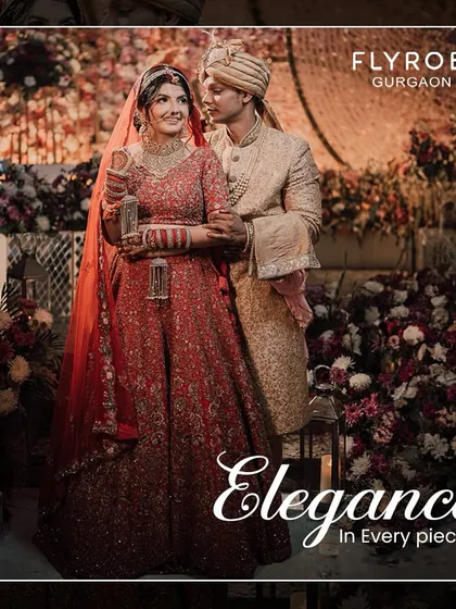 Elegance in every piece. This couple's coordinated red and gold wedding attire is a testament to timeless style. Rent both looks for your big day.