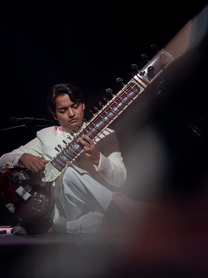 A close-up shot through the crowd at the Piano Man, capturing a moment of intense focus during my performance.