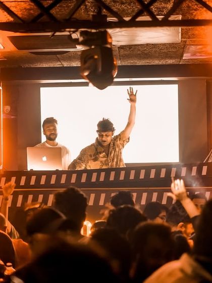 On the booth with my VJ, hands up with the crowd in Hyderabad.