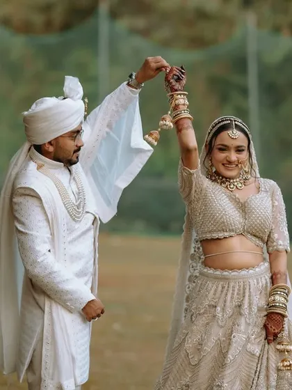 A playful and happy moment as the couple dances together after their wedding ceremony.