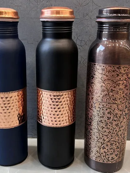 A selection of the different styles of copper and metal bottles I offer for festive gifting. You can choose from hammered, plain, or printed designs and add custom engraving.