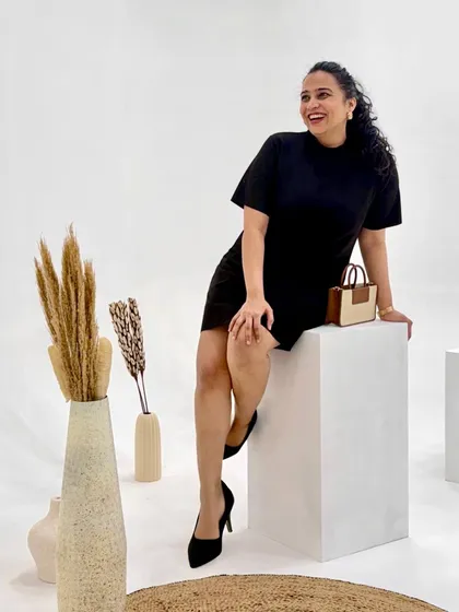 A chic studio shot of me in a classic little black dress. This image showcases a more sophisticated and timeless side of my style, demonstrating my versatility in creating different types of fashion content.