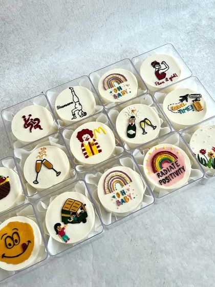 A set of mini bento cakes for a baby shower, where each cake represented a special memory between the mum-to-be and her friends.