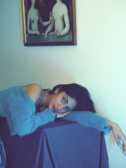 A softer, more intimate moment from the "masterpiece" shoot. The focus is on the dreamy expression and the soft-focus, artistic quality of the image.