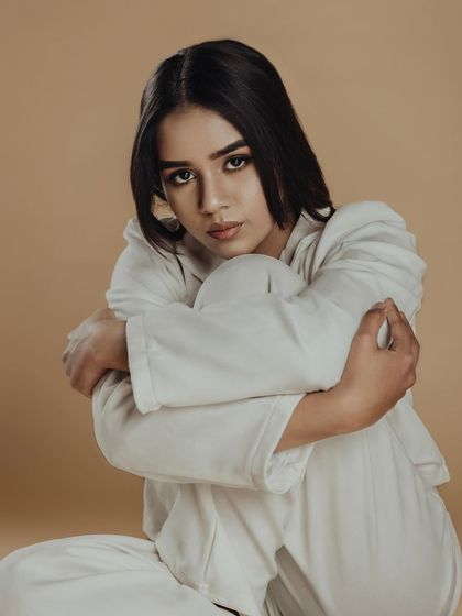 A raw, emotional portrait. The makeup is subtle enough to let the model's expression be the hero of the shot.