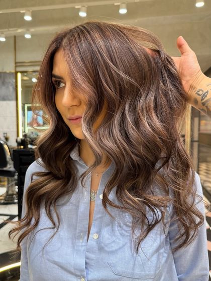 From another angle, you can see the seamless blend of the cool ash brown and subtle blonde. My goal is always to create color that looks beautiful from every perspective.