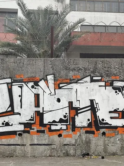 A black and white piece with an orange outline. Even without a lot of color, you can create a powerful piece with strong letter structure and clean lines.