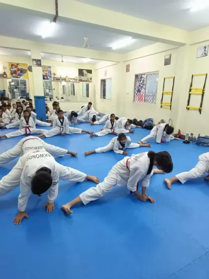 Our students are dedicated to improving their flexibility, holding their stretches to build strength and prevent injury.