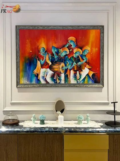 This vibrant painting of Krishna's musical troupe becomes the heart of a dining area, its energy and color framed beautifully by classic wall molding.