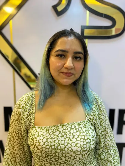 This modern look with blue ombre hair was created during a student training session. It shows their ability to work with creative color and styling.
