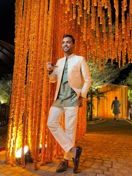 A full-length shot showcasing my ethnic style. The combination of a kurta with a stylish jacket is one of my go-to looks for Indian weddings.