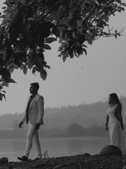 A moody and cinematic black and white photo by the lake. This style is perfect for a dramatic and artistic "Save the Date."