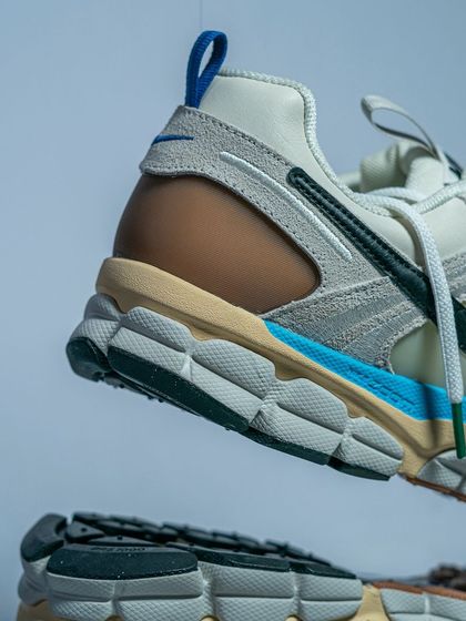 A floating shot of the Nike Zoom Vomero 5, emphasizing the Cushlon and Zoom Air sole unit that makes it so comfortable.