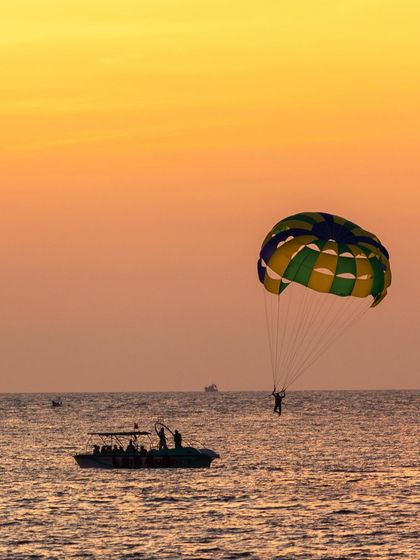 A duplicate of the parasailing shot, highlighting this popular beach activity.
