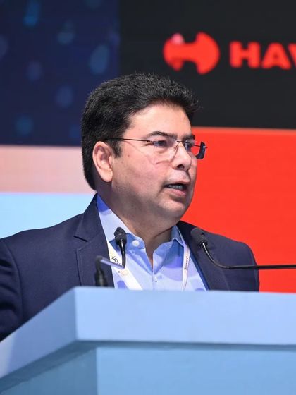 A senior executive delivers a keynote address, sharing strategic insights from a leading industry brand.