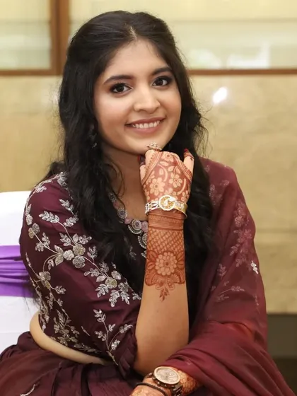 Another beautiful shot highlighting her detailed mehendi and soft glam makeup. A perfect look for an engagement celebration.