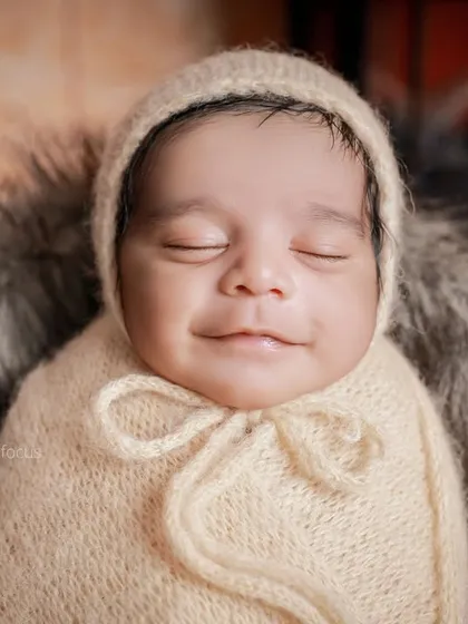 A sweet, smiling close-up from our traveler-themed session. We capture a range of expressions, from peaceful sleep to happy little grins.