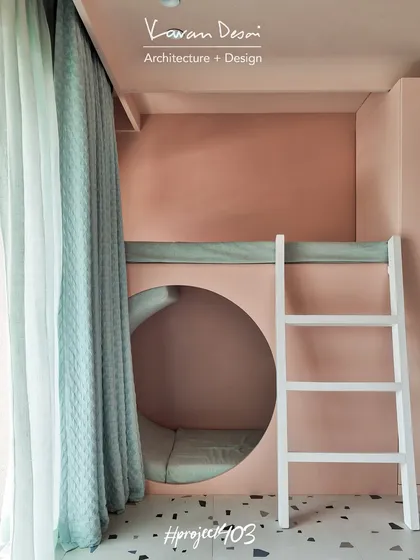 Another view of the kids' room in the Red Fort Project, showing the play loft with a circular cutout looking down into a cozy nook. The design is all about creating different zones for play and rest within a single room.