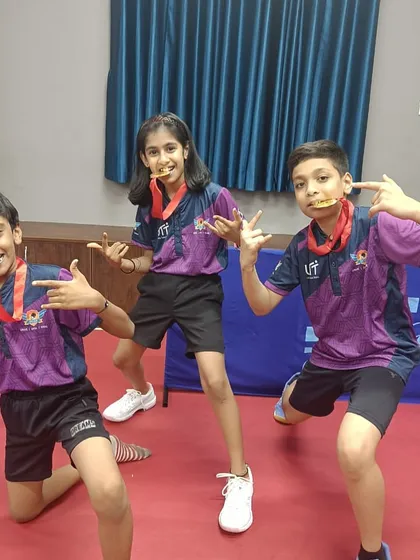 Our junior team celebrating with their medals after winning the team events at the BUDTTA tournament. Teamwork and camaraderie are key values at our academy.