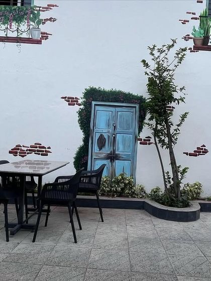 Another shot of the cafe mural, showing how it creates a beautiful backdrop for the outdoor dining tables.