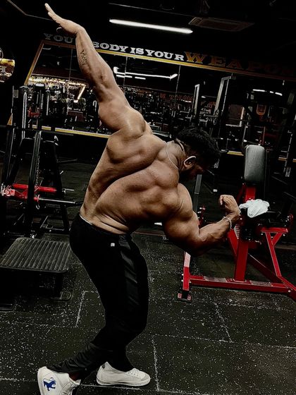 Loyalty in my DNA. A unique back pose showing flexibility and muscle control.