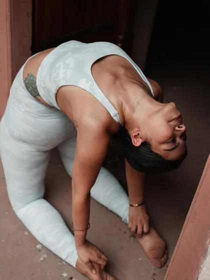A different perspective of Camel Pose, focusing on the deep backbend. It's okay to fall and try again; that's how we learn and grow.