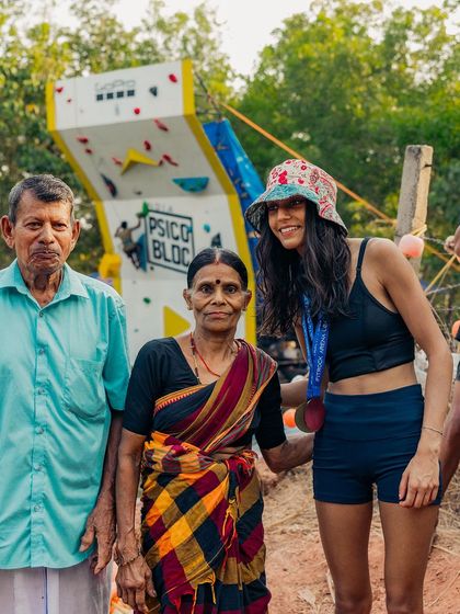 A bronze medalist from the women's competition with the owners of the farm. It's a wonderful connection between the athletes and the people who make the event possible.