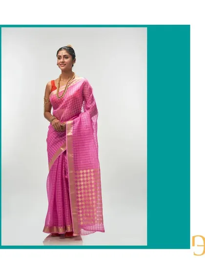 This full-length shot of the mystic pink organza saree shows its vibrant color and elegant drape, a perfect statement piece.