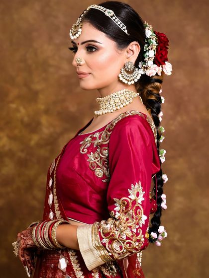 A side view of this intricate floral braid. The hairstyle is both traditional and incredibly photogenic.