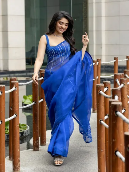 Krithi Shetty looks stunning in this vibrant blue saree. The simple yet modern design is perfect for a festive occasion or a formal event, showing how a single color can make a big impact.