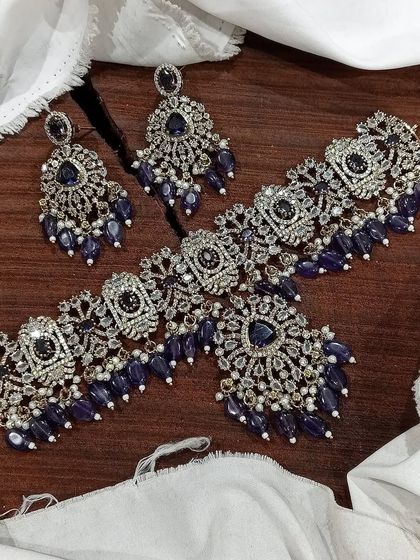 This Victorian choker set in a deep sapphire blue is perfect for evening events. The combination of dark blue stones and sparkling white accents creates a look of sophisticated elegance.