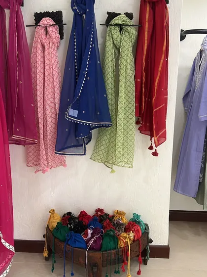 Colorful dupattas and potli bags on display. Accessories are essential for completing any Indian outfit, and I love finding handcrafted options.