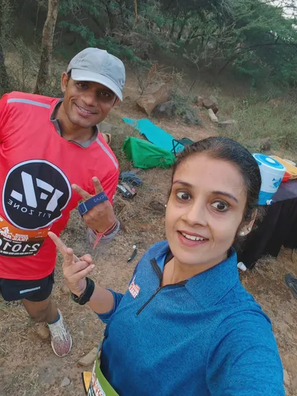 A selfie on the trail with a fellow runner. These candid moments capture the fun of trail running.