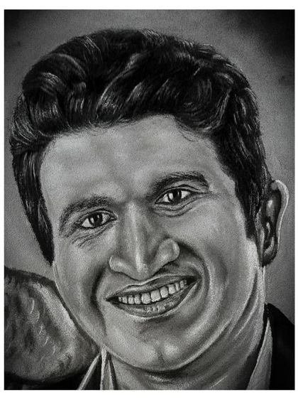 The final artwork of 'Karnataka Ratna' Puneeth Rajkumar, a tribute to a legend. The text and the dove were added to complete the piece, showing how I can incorporate symbolic elements into a charcoal portrait.