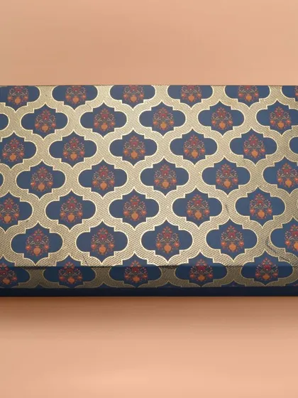 A long rectangular box with a royal blue and gold traditional Indian pattern. We ensure patterns are sharp and colors are true to life.