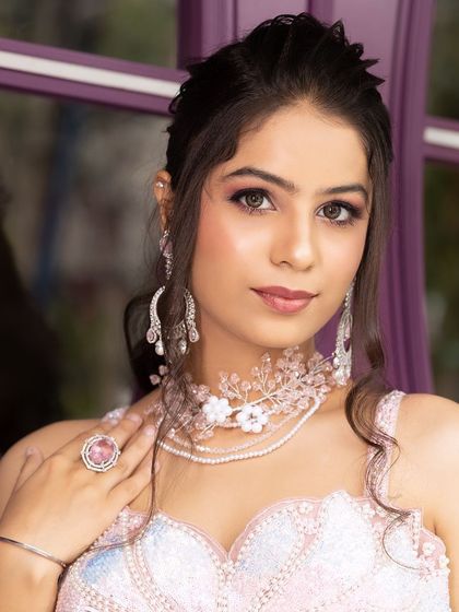 A series of portraits from an engagement shoot, featuring a model in a pink lehenga and modern jewellery. This is a great reference for a soft, romantic look.