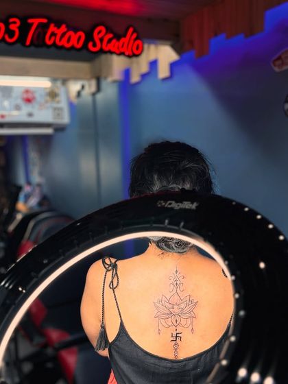 A view of the finished spiritual back tattoo from inside the studio. The lighting and professional setup ensure a great experience and a perfect result.