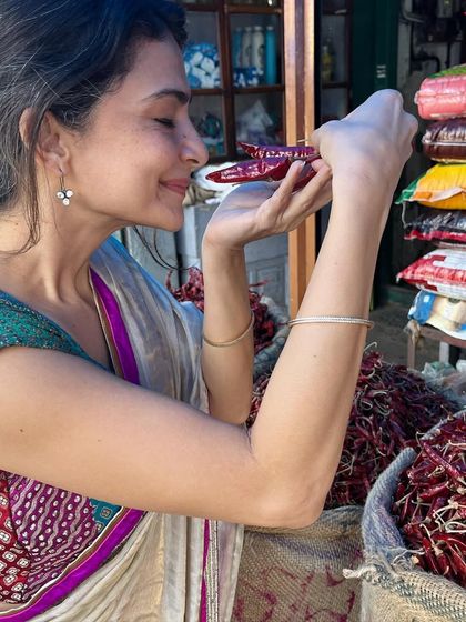 The rich aroma of dried red chilies at the market. Spices are the heart of Indian cooking, and I love sourcing them fresh and local.